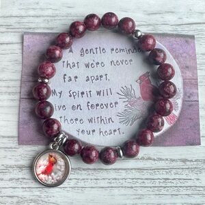 Elegant Beaded Bracelet with Cardinal Charm